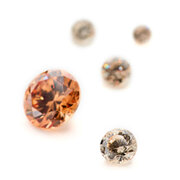 Synthetic champagne coloured cubic zirconia, round diamond cut