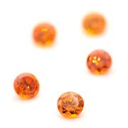 Synthetic orange cubic zirconia, round diamond cut