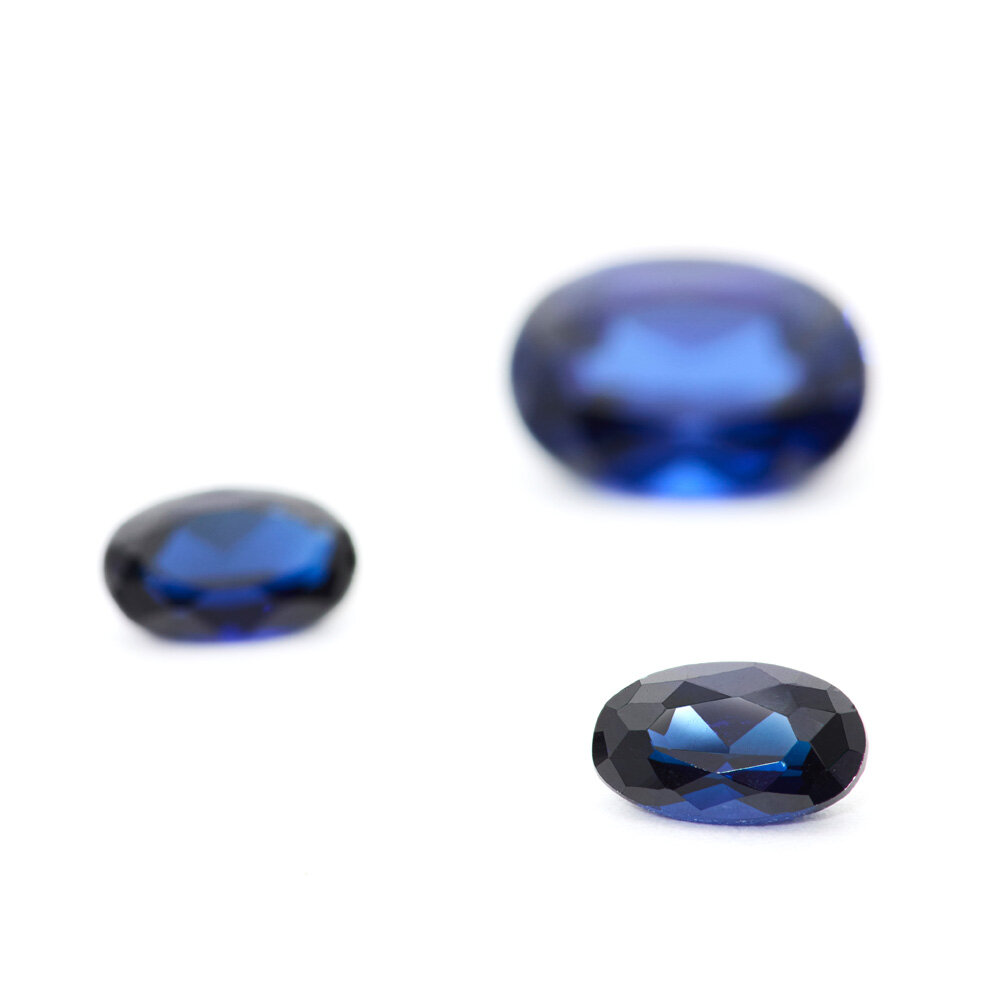 Synthetic blue sapphire, oval diamond cut 