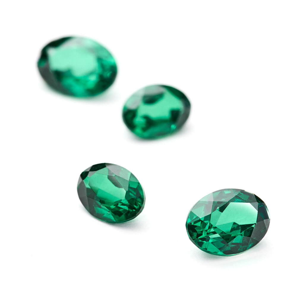Synthetic emerald, oval diamond cut 
